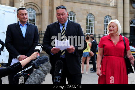 Mark Rodgers, father of Poppy Rodgers, reads a statement from the family alongside his brother Andrew (left) and Poppy's mother Ann (right) outside York Crown Court as Luke Carey, 24, was jailed for six years and five months today for supplying the Class A drug that killed their daughter. Stock Photo