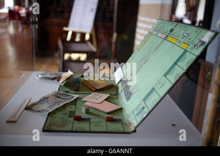 The Monopoly board found during the investigation as officers who worked on the case of the Great Train Robbery received commendations from current Thames Valley Police Chief Constable Sara Thornton at a ceremony at Eynsham Hall, Witney, Oxfordshire. PRESS ASSOCIATION Photo. Picture date: Wednesday August 7, 2013. Mr Milner was a detective at Aylesbury at the time of the robbery, while Mr Woolley was a PC and discovered Leatherslade Farm, where the men hid after committing the crime. On August 8, 1963 a gang of robbers, masterminded by Bruce Reynolds, stopped the Glasgow-Euston overnight mail Stock Photo