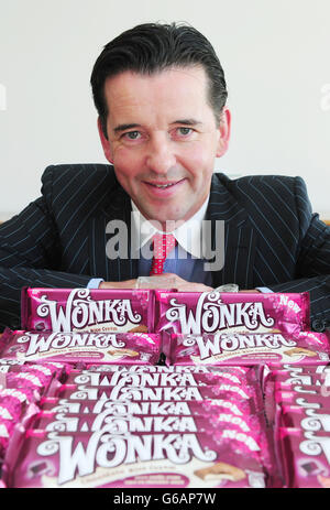 Ciaran Sullivan, Managing Director of Nestle Confectionery UK & Ireland, with a selection of the new range of Wonka chocolate bars named after one of the world's most famous fictional confectioners, Willy Wonka. Stock Photo