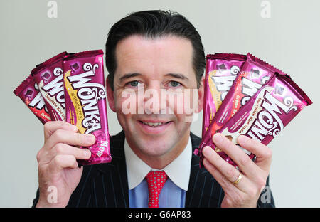 Ciaran Sullivan, Managing Director of Nestle Confectionery UK & Ireland, with a selection of the new range of Wonka chocolate bars named after one of the world's most famous fictional confectioners, Willy Wonka. Stock Photo