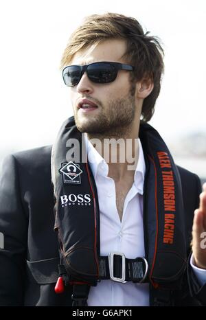 Actor Douglas Booth pictured before the Artemis Challenge at Aberdeen Asset Management Cowes Week where he sailed onboard the Open 60 racing yacht, Hugo Boss, with round the world yachtsman Alex Thomson and fellow actor Sam Reid. Stock Photo