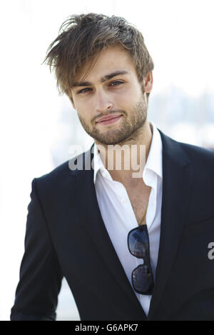 Actor Douglas Booth pictured before the Artemis Challenge at Aberdeen Asset Management Cowes Week where he sailed onboard the Open 60 racing yacht, Hugo Boss, with round the world yachtsman Alex Thomson and fellow actor Sam Reid. Stock Photo