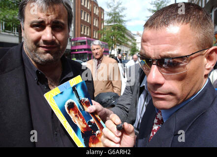 Actor Jean Claude Van Damme signs autographs as he attends the unveiling ceremony of a Musical Heritage Blue Plaque, at the site of the old Apple records building, London, in honour of John Lennon. Stock Photo