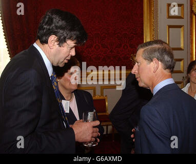 The Prince of Wales talks with John Geldard (right) from the Plumgarths farm shop in Cumbria, after a meeting of leaders of the Business in the Community seminar, at St James's Palace in Central London. *... The Prince of Wales warned that rural communities were still suffering from 'some of the hardest times ever known'. Charles made an impassioned plea for established firms to support and encourage enterprise in the countryside as he addressed business leaders. Stock Photo