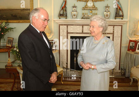 Queen Elizabeth II talks with Australian Prime Minister John Howard, during a private meeting at Buckingham Palace, London. Stock Photo