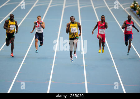 Jamaica's Usain Bolt (centre) leads the field from Jamaica's Warren Weir (left) and USA's Curtis Mitchell (2nd right) who came third in the Men's 200m Final on day eight of the 2013 IAAF World Athletics Championships at the Luzhniki Stadium in Moscow, Russia. Stock Photo