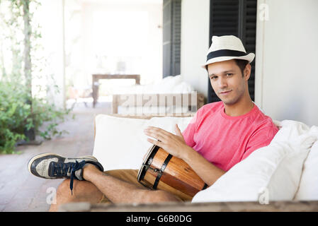 Man playing conga Stock Photo