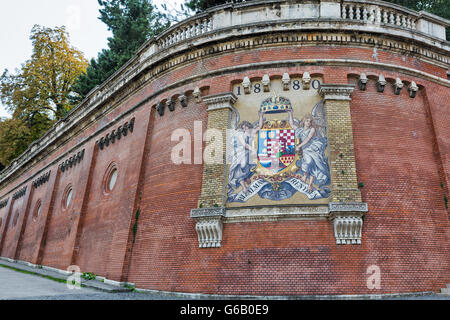 Ancient mosaic Coat of arms on Castle Hill wall in Budapest, Hungary. Stock Photo
