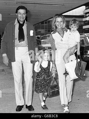 Young Barnaby (in his mother's arms) has a black eye as he leaves with actress Honor Blackman, sister Lotty and Honor's husband Maurice Kauffman for Australia. Stock Photo
