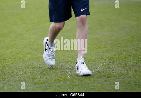 Eastbourne, UK. 23rd June, 2016. Aegon International Eastbourne Tennis Tournament. A ball boy splashes through a rain soaked court at Devonshire Park. © Action Plus Sports/Alamy Live News Stock Photo