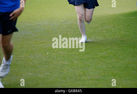 Eastbourne, UK. 23rd June, 2016. Aegon International Eastbourne Tennis Tournament ball girl and ball boy splash through a rain soaked court at Devonshire Park. © Action Plus Sports/Alamy Live News Stock Photo