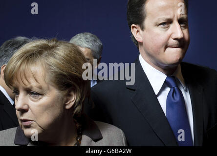 (L-R) Angela Merkel, Germany's chancellor, and  British Prime Minister David Cameron   pose for  a family photo during an extraordinary EU summit focused on Libya  in  Brussels, Belgium on 2011-03-11  . The leaders of the 27-nation European Union will examine the prospects for military intervention via a no-fly zone, humanitarian aid and economic measures.  by Wiktor Dabkowski | usage worldwide Stock Photo