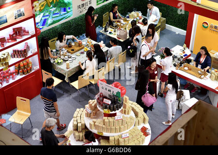 Beijing, China. 24th June, 2016. Visitors tast tea during the Beijing International Tea Expo in Beijing, capital of China, June 24, 2016. The four-day tea expo kicked off here Friday. Credit:  Li Xin/Xinhua/Alamy Live News Stock Photo