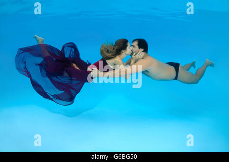 October 15, 2014 - Odessa, pool, Ukraine - Man and woman kissing under water, Underwater fasihon in the pool, Odessa, Ukraine (Credit Image: © Andrey Nekrasov/ZUMA Wire/ZUMAPRESS.com) Stock Photo