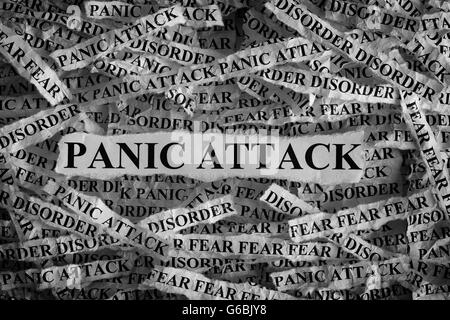 Panic Attack. Torn pieces of paper with the word Panic Attack. Concept Image. Black and White. Closeup. Stock Photo