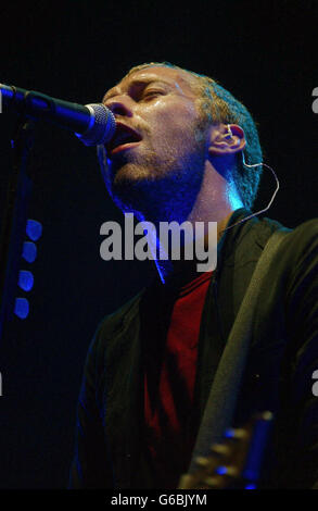 Chris Martin, lead singer of rock band Coldplay performing live at Earls Court. Stock Photo