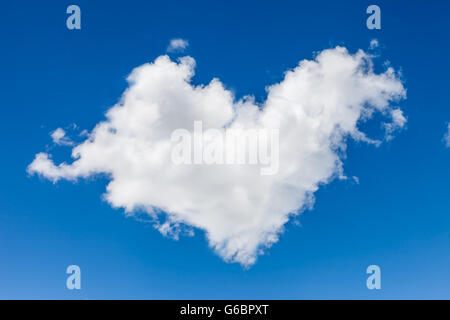 Cloud in heart shape in front of blue sky Stock Photo - Alamy