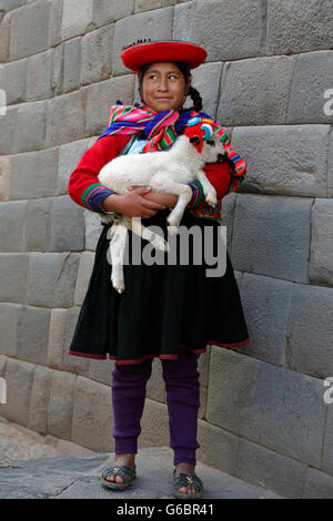 Yenny and her lamb, Cusco, Peru Stock Photo