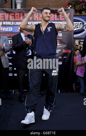 WBO World Light-Heavyweight Champion Nathan Cleverly arrives on stage during the weigh in in Queen Street, Cardiff. Stock Photo