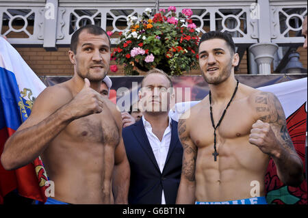 Boxing - WBO Light Heavyweight Title - Nathan Cleverly v Sergey Kovalev - Weigh In - Cardiff. WBO World Light-Heavyweight Champion Nathan Cleverly, right, and Russian Sergey Kovalev during the weigh in in Queen Street, Cardiff. Stock Photo