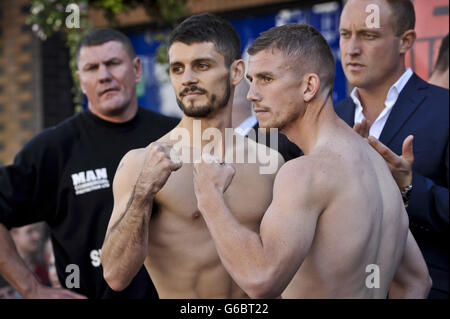 Gary Buckland (right) and Stephen Smith pose for TV cameras during the weigh in in Queen Street, Cardiff. Stock Photo