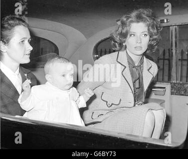 Suzy Parker, actress, with her eight-month-old baby daughter Georgia (in nurses arms) as she left Eaton Square, London en route for Southampton Docks and the USA. Stock Photo