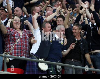 Scotland fans celebrate in the stands after Scotland's James Morrison (not in picture) scores his team's opening goal Stock Photo