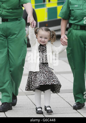 Three-year-old Casey McLean with the paramedics who saved her life after she went into cardio /respiratory arrest in Glasgow. PRESS ASSOCIATION Photo. Picture date: Thursday August 15, 2013. A three-year-old girl has been reunited with paramedics who saved her life as the ambulance service revealed it is getting to life-threatening calls quicker. Casey McLean, from Colston in Glasgow, was resuscitated by ambulance staff after she went into cardio /respiratory arrest before being rushed to hospital, where she was successfully treated. See PA story: SCOTLAND Ambulance. Photo credit should read: Stock Photo