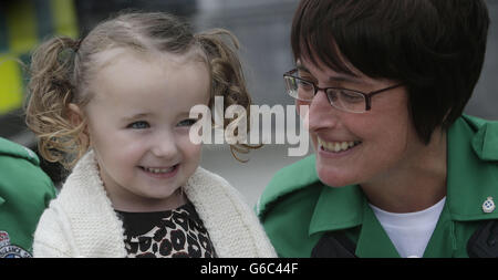 Three-year-old Casey McLean with the Julie Grainger, one of the paramedics who saved her life after she went into cardio /respiratory arrest in Glasgow. Stock Photo
