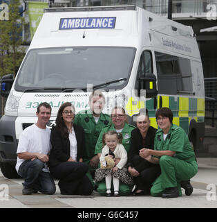 Girl meets life-saving paramedics Stock Photo