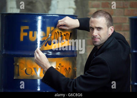 Actor Joseph Fiennes, poses for the media during a photocall in London to launch Christian Aid's Oil and Poverty Report. The report reveals the human cost to poor communities across the world because of the west's thirst for oil and comes during Christian Aid Week. Stock Photo