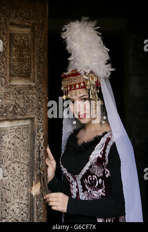 Traditionally Dressed Uzbek Woman Performer at the Toshhovli Palace in Khiva Uzbekistan Stock Photo