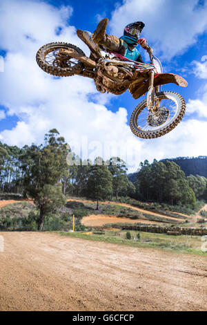 Motocross rider jumping a tabletop at Blackwood Park motocross track. Stock Photo