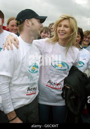 Singer Ronan Keating gets a last minute hug from wife Yvonne, before the start of his Walk of Ireland. Starting at the Giants Causeway in Northern Ireland, to Kinsale in Co Cork in the Irish Republic, the trek is over 300 miles long and is in aid of Cancer research. *... Ronan's mother lost her battle against cancer a number of years ago. Stock Photo