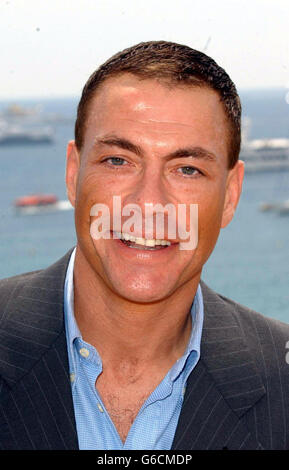 Jean Claude Van Damme poses for photographers during a photocall on the roof of the Noga Hilton Hotel, Cannes, to promote his new film 'After Death'. Stock Photo