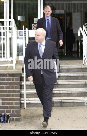 Detective Sergeant David Flood (front) of the Serious Crime Group, UK and Detective Sergeant Peter O'Boyle of Crumlin Garda Station, Ireland, leave Camberwell Green Magistrates Court, south London. * Christopher Newman, 60, appeared accused of stabbing his young lover, Georgina Eager, 29, on or before May 22, in Dublin. Newman - a homeopathic doctor - who is also known by the name of Saph Dean, was arrested in a black taxi cab on Westminster Bridge on Thursday - just minutes before gardai discovered Miss Eager's corpse at her home in Walkinstown, Dublin. Newman, formerly of St Peter's Road, Stock Photo