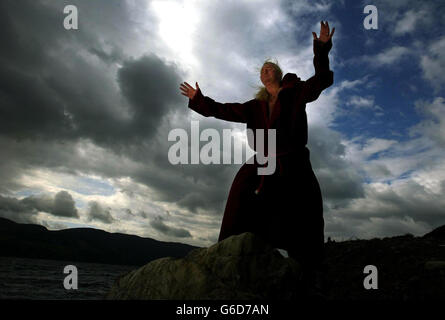 Kevin Carlyon, High Priest of the British Coven of White Witches casting spells in a bid to lure the Loch Ness monster out into the open. He was trying to encourage an appearance from Nessie * .. claiming there have been few sightings since he cast a spell to protect the mythical monster two years ago. Mr Carlyon, from Hastings, East Sussex, blessed nature's elements to ward off evil spirits and dropped a talisman into the murky loch to protect the water and all the creatures within it. Stock Photo