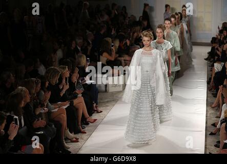 Models on the catwalk during the Temperley Spring/Summer 2014 show at the Savoy Hotel in London as part of London Fashion Week. Stock Photo