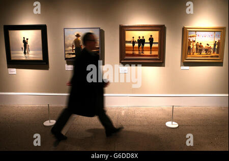 A person walks past the painting The Billy Boys by Jack Vettriano at the Kelvingrove Art Gallery in Glasgow where more than 100 paintings spanning his entire career are on display opening to the public on Saturday 21 September 2013. This once in a lifetime Retrospective gathers together all of the artist's most famous works for the first time including Dance me to the end of Love (1998), Bluebird at Bonneville (1996), The Billy Boys (1994) and The Singing Butler (1992). Stock Photo
