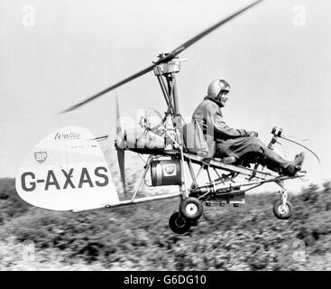 Wing Commander Kenneth Wallis takes off from a headland, near Newhaven, in an autogyro fitted with infra-red cameras. The craft was able to take X-ray pictures up to 2,000 feet above the Sussex Downs, which scientists hope will enable them to spot clues to the disappearance of Lord Lucan. Stock Photo