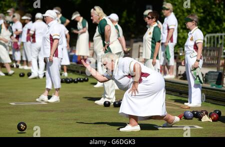 Members of the Windsor and Eton Bowling Club enjoy a game of bowls in the afternoon sunshine in Windsor, Berkshire. Stock Photo