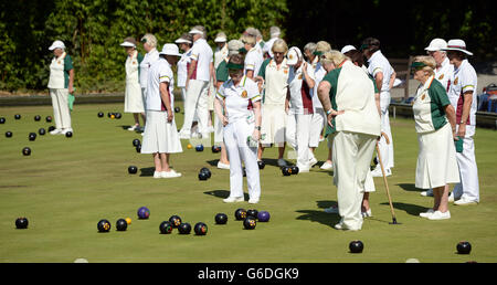 Members of the Windsor and Eton Bowling Club enjoy a game of bowls in the afternoon sunshine in Windsor, Berkshire. Stock Photo