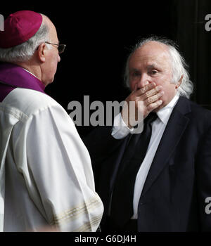 Artist Richard Demarco (right) and Bishop Mario Conti (left) following the funeral of artist John Bellany at St Giles Cathedral in Edinburgh following his funeral. Stock Photo