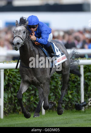 Horse Racing - Ladbrokes St Leger Festival - Ladbrokes St Leger Day - Doncaster Racecourse. Outstrip and Mickael Barzalona win the ATR Champagne Stakes during the Ladbrokes St Leger Festival at Doncaster Racecourse. Stock Photo