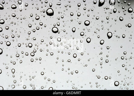 Water droplets beaded up on a glass window in the summer Stock Photo