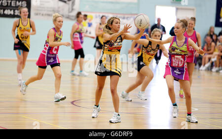 Samia Ghadie (left) from Coronation Street passes the ball as Eden Taylor-Draper from Emmerdale looks on during a charity netball match between Coronation Street and Emmerdale at the Manchester Thunderdome in Manchester. Stock Photo
