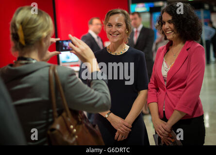 Wife of Labour leader Ed Miliband, Justine Thornton (centre) tours the exhibition stands on the first day of Labour's annual party conference in Brighton. Stock Photo