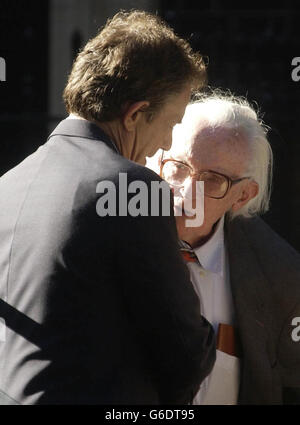 The former Labour Party Leader Michael Foot (right) is greeted on the steps of No 10 Downing Street, London, by the Prime Minister Tony Blair. Tony Blair was expected to host a party for Michael Foot, to mark the former Labour leader's 90th birthday later this month. Stock Photo