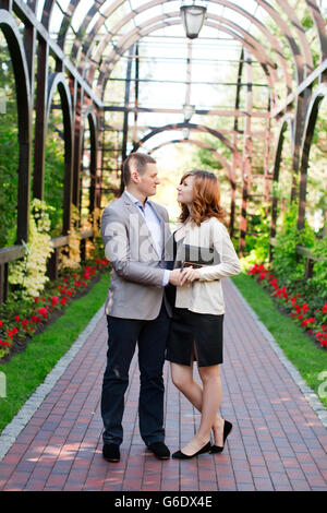 Man tenderly embraced Pregnant Woman Stock Photo