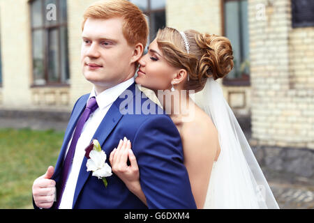 The bride groom gently embraced Stock Photo